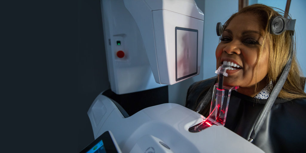 African-american woman undergoing a 3D CBCT scan.