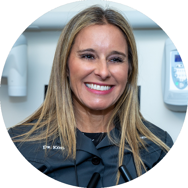 Headshot of smiling cosmetic dentist Dr. Tara Kois.