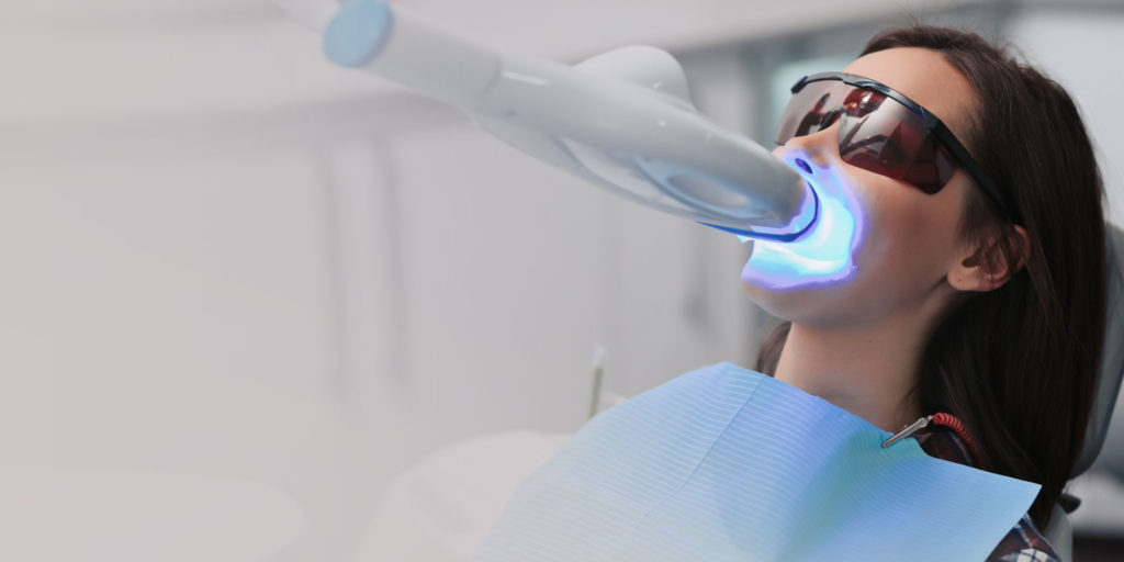 dental patient undergoing teeth whitening procedure